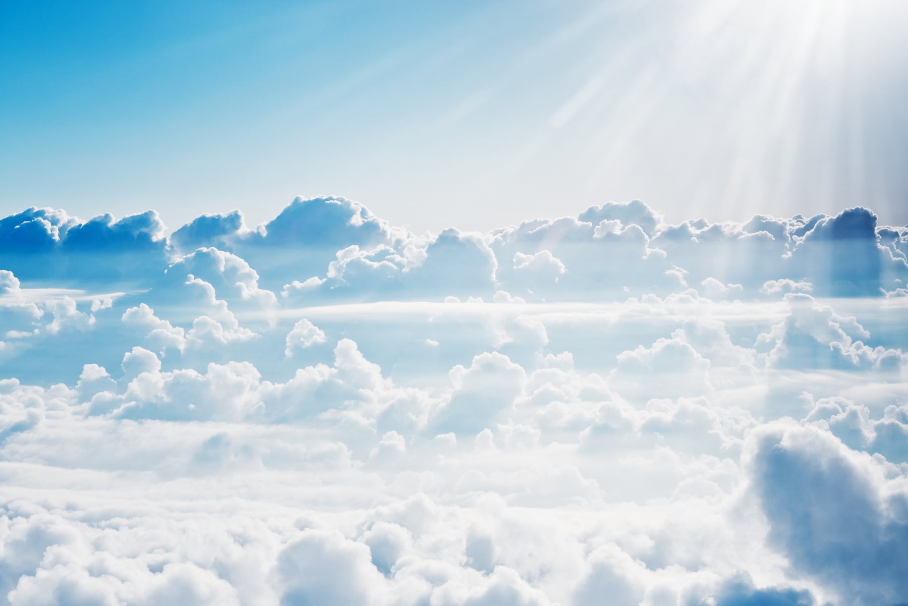 Aerial view on white fluffy clouds